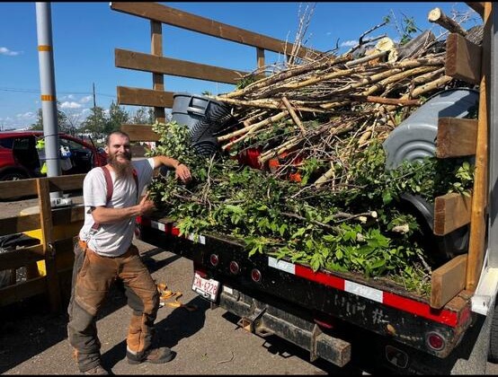 Spencer from AJS Slashing with a full load of tree debris